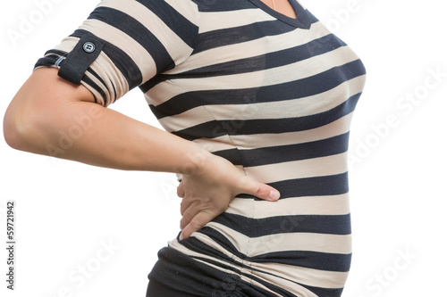 Photo: Woman suffering from back pain isolated on white Woman suffering from back pain isolated on white