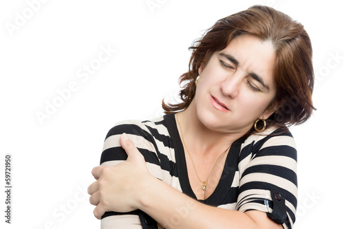 Photo: Hispanic woman suffering from shoulder pain Hispanic woman suffering from shoulder pain