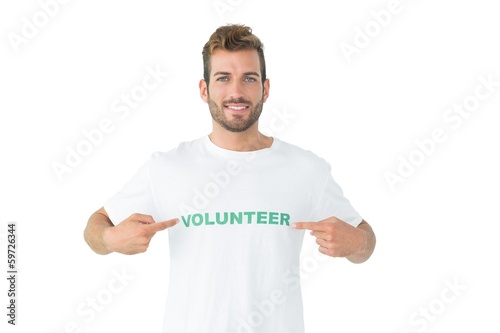 Photo: Portrait of a happy male volunteer pointing to himself Portrait of a happy male volunteer pointing to himself