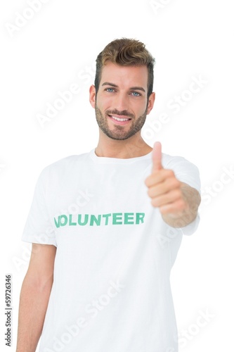 Photo: Portrait of a happy male volunteer gesturing thumbs up Portrait of a happy male volunteer gesturing thumbs up