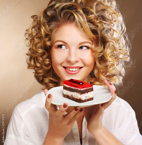 Photo: young woman with a cake young woman with a cake