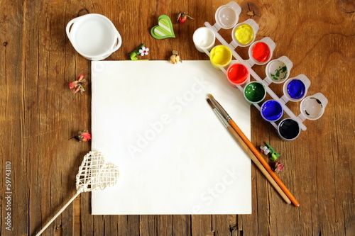 Photo: painting set - brushes, paints (gouache) on old wooden table painting set - brushes, paints (gouache) on old wooden table