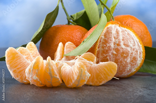 Photo: Orange mandarin or tangerine fruit with leaves Orange mandarin or tangerine fruit with leaves