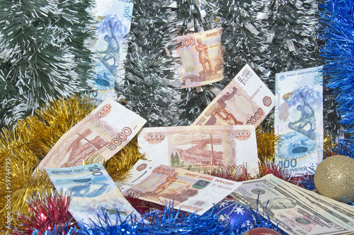 Photo: Christmas tinsel and banknotes Christmas tinsel and banknotes