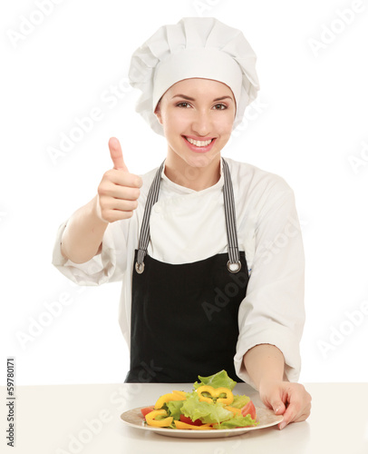 Photo: Attractive cook woman showing ok over white background Attractive cook woman showing ok over white background