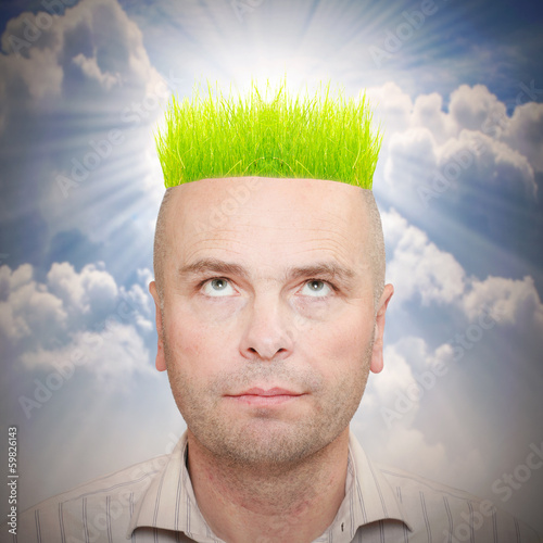 Photo: Businessman with hairstyle from green grass. Ecology metaphor. Businessman with hairstyle from green grass. Ecology metaphor.