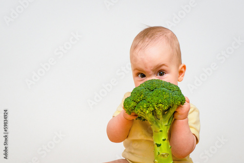 Photo: Baby eating broccoli Baby eating broccoli