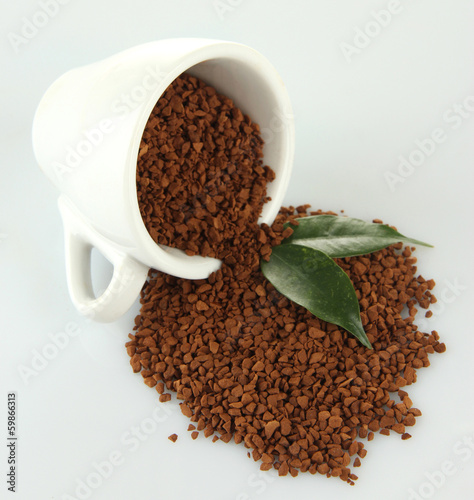 Photo: Cup with instant coffee isolated on white Cup with instant coffee isolated on white