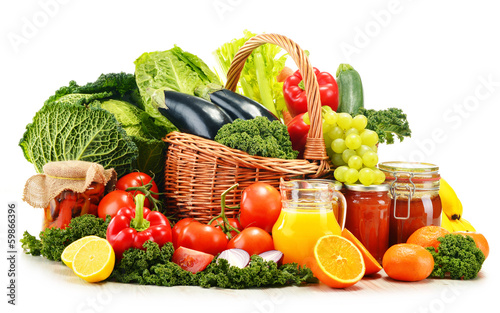 Photo: Wicker basket with assorted organic vegetables and fruits isola Wicker basket with assorted organic vegetables and fruits isola