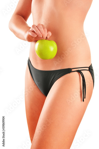 Photo: Slim woman's body isolated on white background Slim woman's body isolated on white background