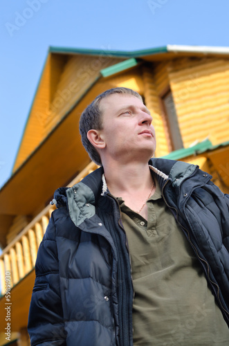 Photo: Handsome man standing thinking Handsome man standing thinking
