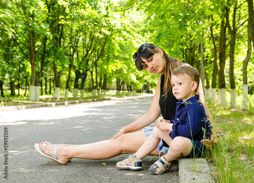 Photo: Mother and son waiting in a rural street Mother and son waiting in a rural street