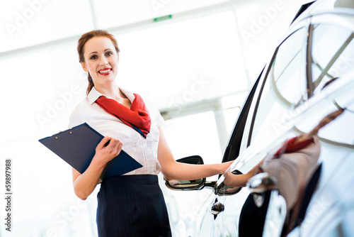 Photo: young woman in a showroom consultant young woman in a showroom consultant