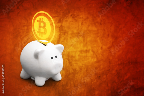 Photo: Saving bitcoins in piggy coin bank Saving bitcoins in piggy coin bank