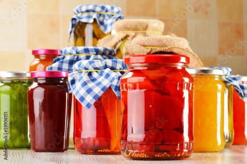 Photo: Jars of marinated food. Pickled vegetables and jams Jars of marinated food. Pickled vegetables and jams