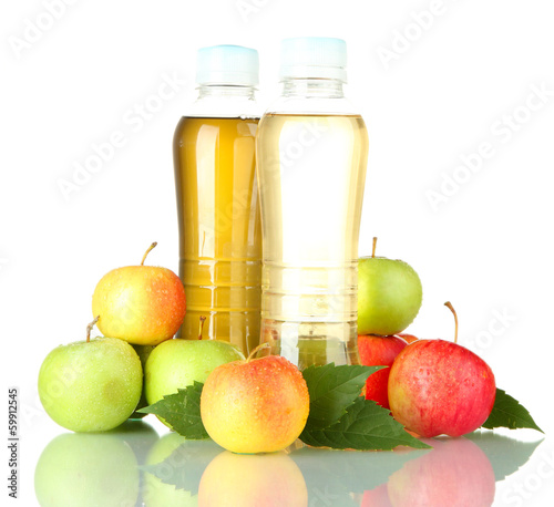 Photo: two bottles of juice with sweet apples, isolated on white two bottles of juice with sweet apples, isolated on white