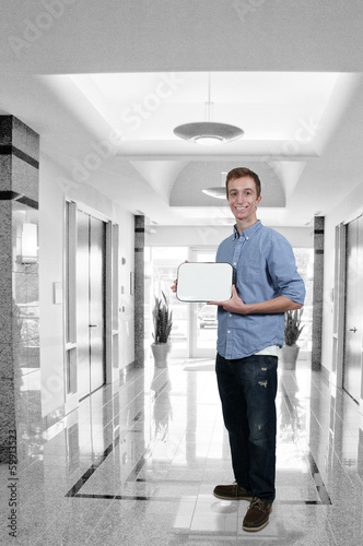Photo: Man Holding Blank Sign Man Holding Blank Sign