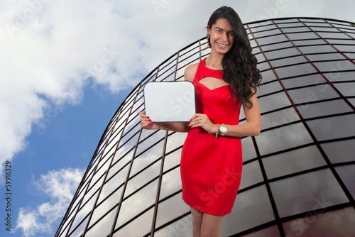 Photo: Woman Holding a Blank Sign Woman Holding a Blank Sign