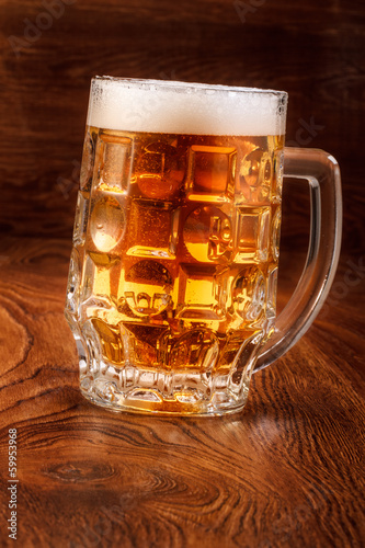 Photo: Beer on wood background Beer on wood background