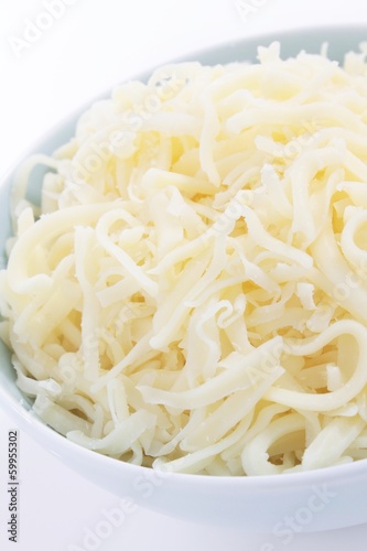 Photo: grated mozzarella in bowl grated mozzarella in bowl