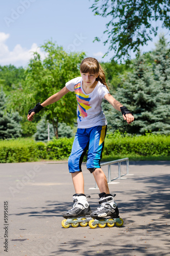 Photo: Young teenage girl in a skate park Young teenage girl in a skate park