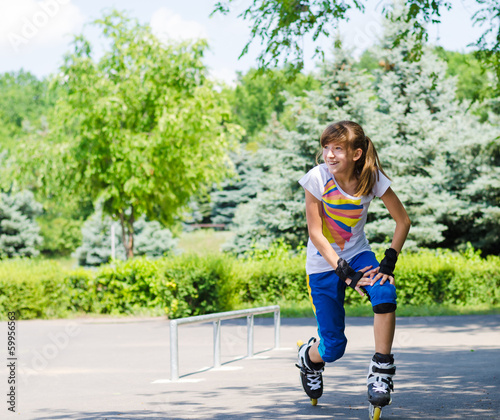 Photo: Teenage girl limbering up before skating Teenage girl limbering up before skating