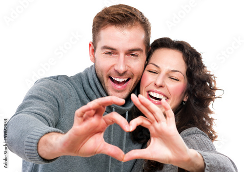 Photo: Valentine Couple. Girl and her Boyfriend making shape of Heart Valentine Couple. Girl and her Boyfriend making shape of Heart
