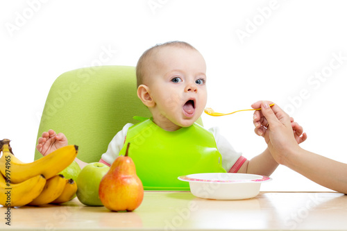 Photo: baby eating healthy food fruits baby eating healthy food fruits