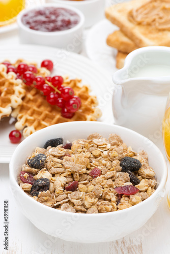 Photo: muesli waffles with berries, jams, milk for breakfast muesli waffles with berries, jams, milk for breakfast
