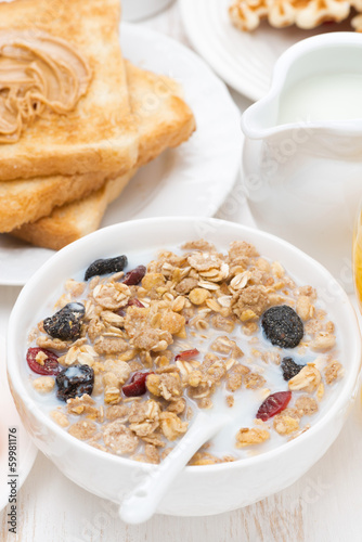 Photo: muesli with milk, toast with peanut butter for breakfast muesli with milk, toast with peanut butter for breakfast