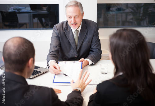 Photo: Businessman showing a document Businessman showing a document