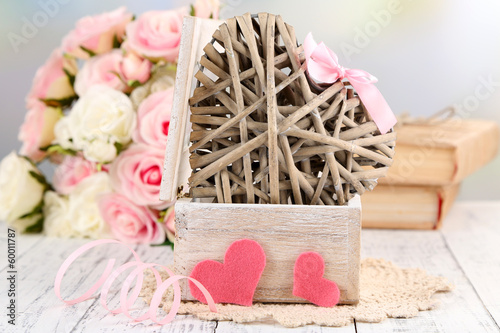 Photo: Romantic still life with heart in wooden casket Romantic still life with heart in wooden casket