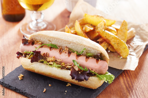 Photo: Gourmet hot dog on slate board Gourmet hot dog on slate board