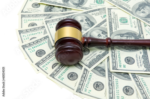 Photo: gavel and U.S. dollars closeup gavel and U.S. dollars closeup