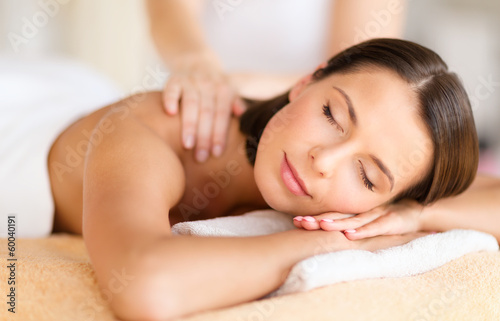Photo: beautiful woman in spa salon getting massage beautiful woman in spa salon getting massage