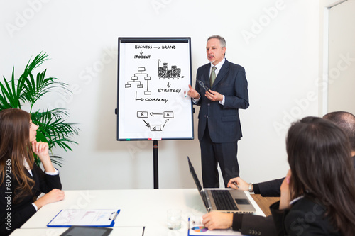 Photo: Man explaining business concepts Man explaining business concepts