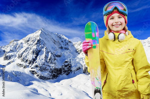 Photo: Ski, winter fun - lovely skier girl enjoying ski holiday Ski, winter fun - lovely skier girl enjoying ski holiday