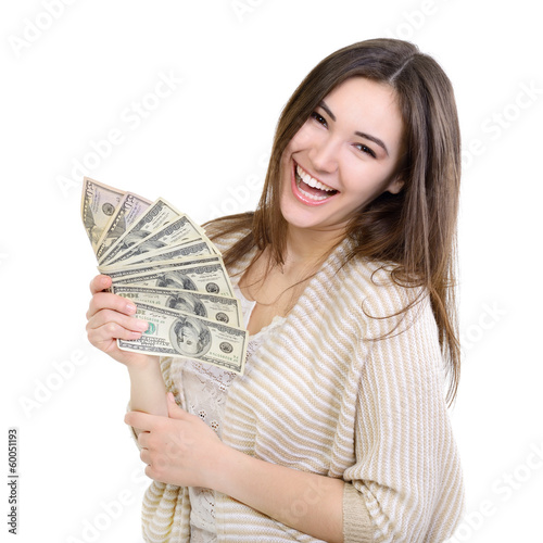 Photo: Cheerful attractive young lady holding cash and happy smiling ov Cheerful attractive young lady holding cash and happy smiling ov