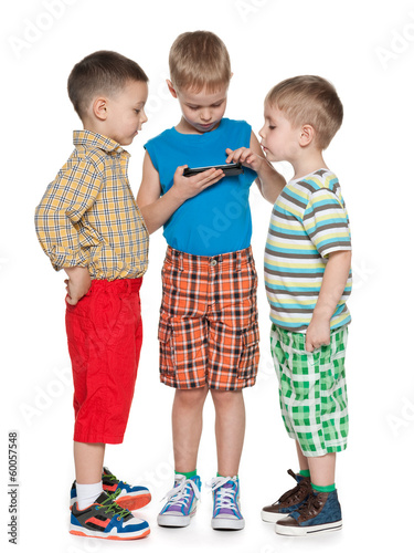 Photo: Boys playing with a new gadget Boys playing with a new gadget