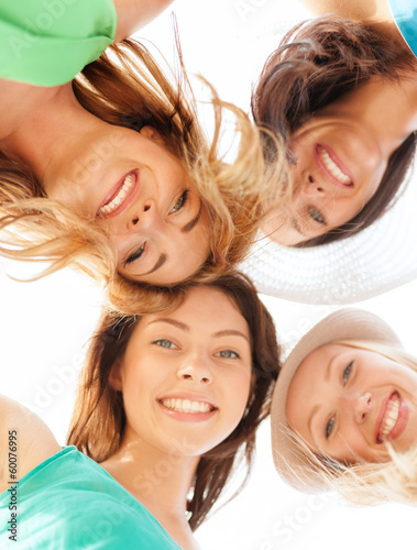 Photo: faces of girls looking down and smiling faces of girls looking down and smiling