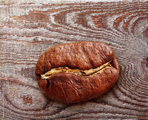 Photo: Black coffee grain, bean on wooden background. Black coffee grain, bean on wooden background.