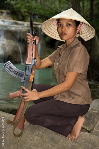 Photo: Asian woman armed Asian woman armed