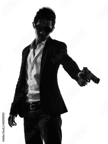 Photo: asian gunman killer portrait shooting silhouette asian gunman killer portrait shooting silhouette