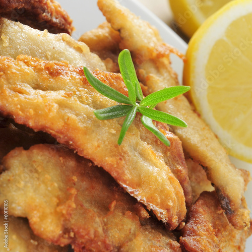 Photo: spanish boquerones fritos, battered and fried anchovies typical spanish boquerones fritos, battered and fried anchovies typical
