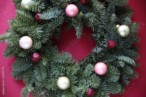 Photo: ornaments and bells on fresh Christmas wreath ornaments and bells on fresh Christmas wreath