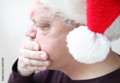 Photo: nauseated senior in holiday hat nauseated senior in holiday hat