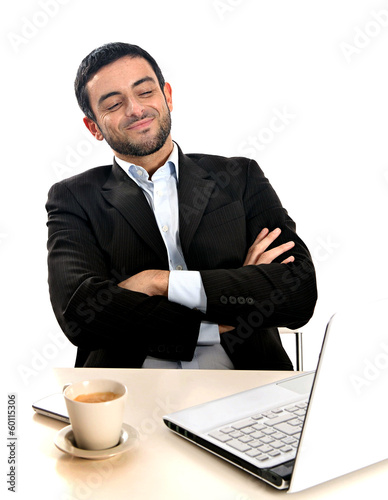 Photo: Relaxed Businessman working with computer Relaxed Businessman working with computer