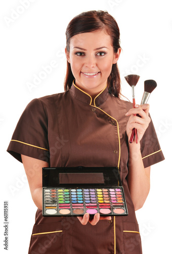 Photo: Professional beautician holding brushes Professional beautician holding brushes
