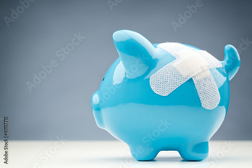 Photo: Savings Risk or Danger - Bandaged Piggy Bank Savings Risk or Danger - Bandaged Piggy Bank