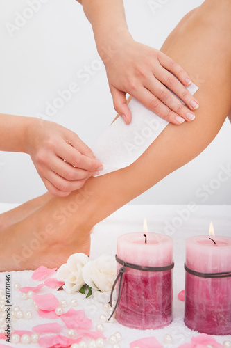 Photo: Beautician Waxing A Woman's Leg Beautician Waxing A Woman's Leg
